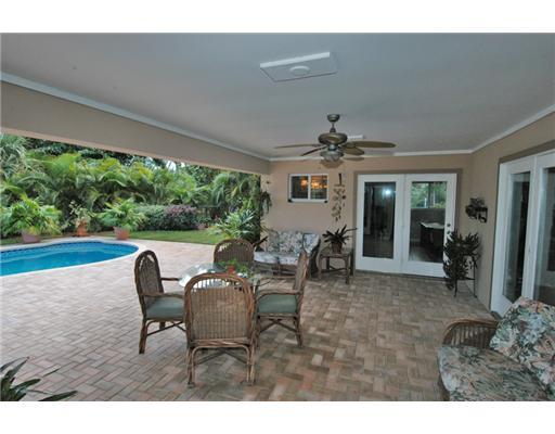 112 Northwest S Shore Road Stuart, FL 34994 - Photo 9 of 16 a living room with furniture and a large window