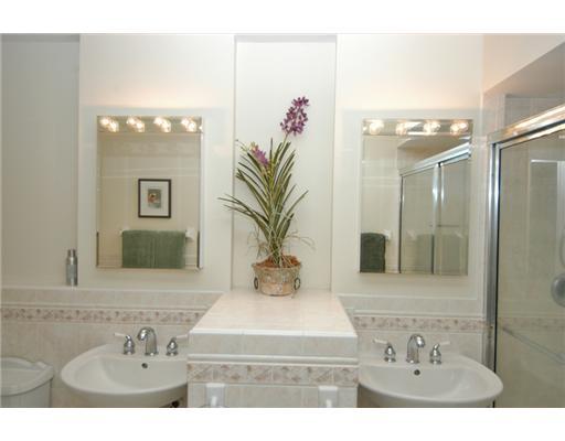 112 Northwest S Shore Road Stuart, FL 34994 - Photo 10 of 16 a bathroom with a sink and a mirror