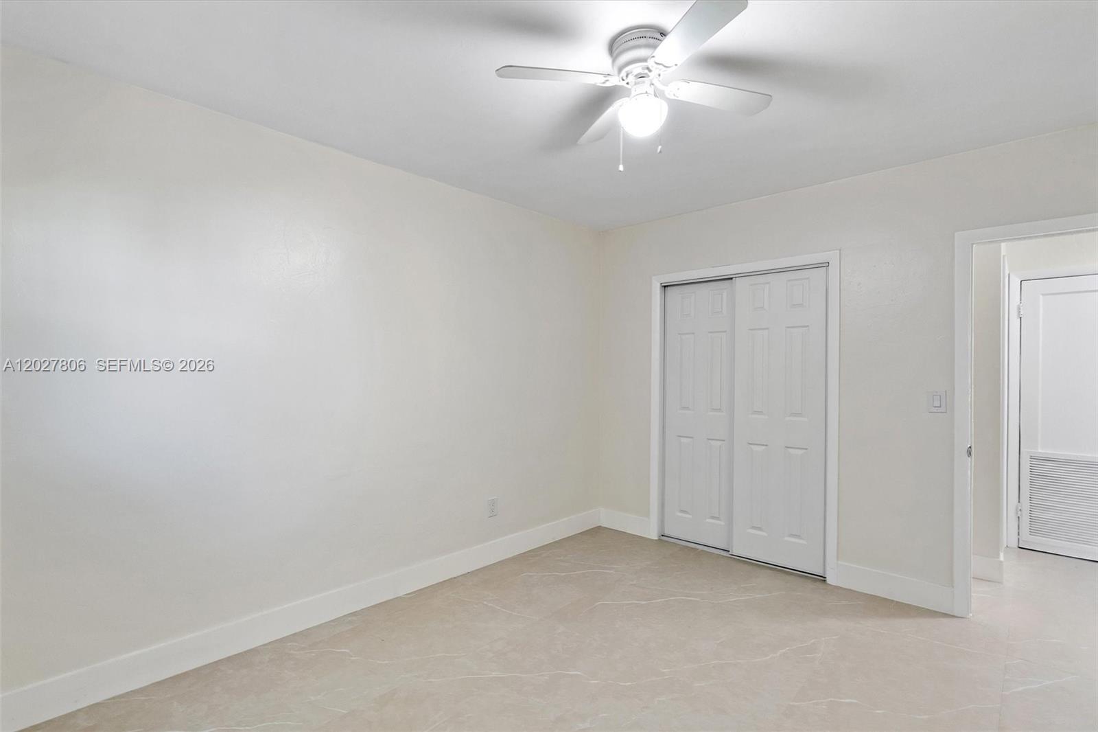 1612 Southwest 23rd Street, Unit 1612 Miami, FL 33145 - Photo 36 of 42 an empty room with a ceiling fan and a fan