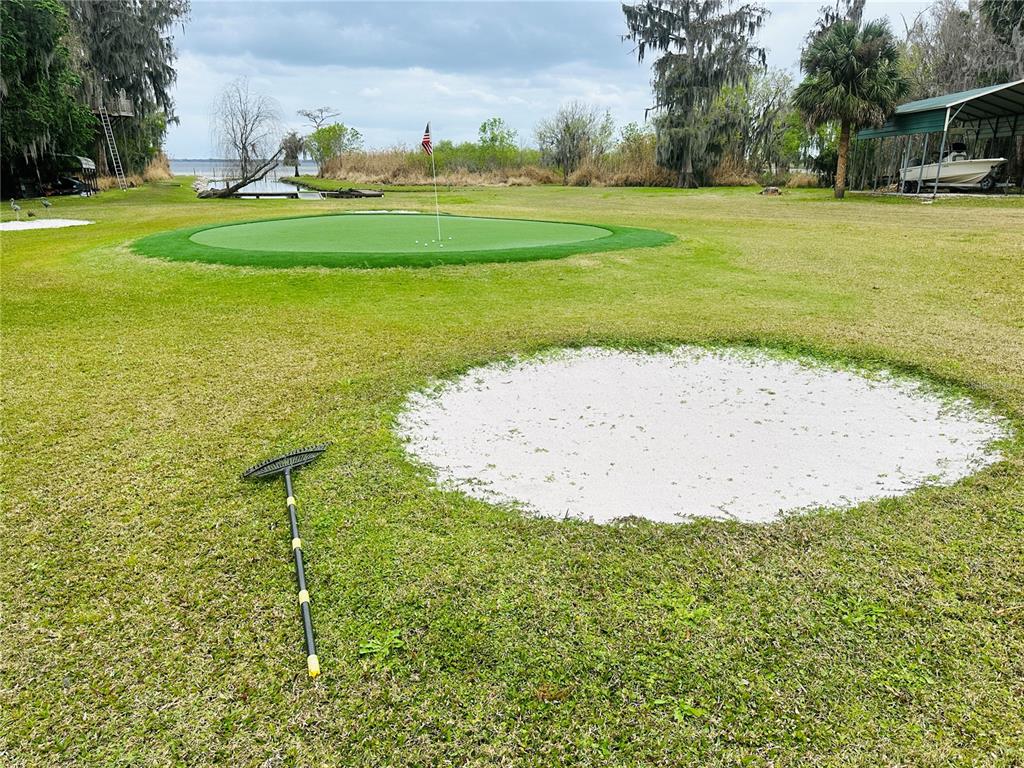 357 Magnolia Place DeBary, FL 32713 - Photo 35 of 50 a view of a golf course with a lake