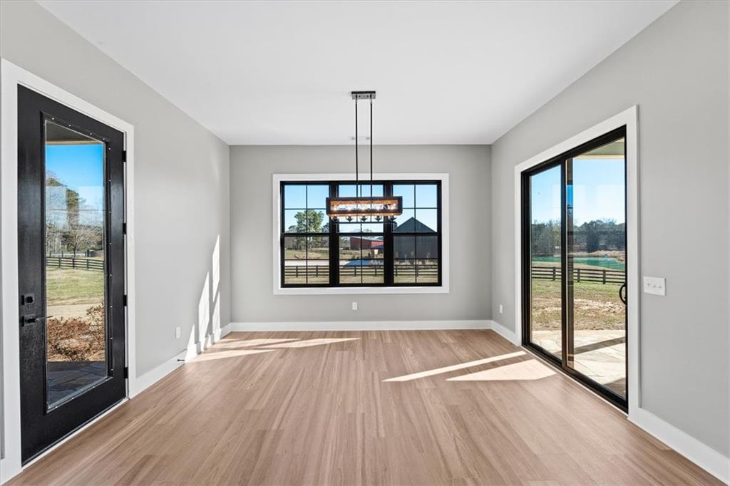 1237 Morgan Road Temple, GA 30179 - Photo 21 of 52 a view of an empty room with glass door and glass window