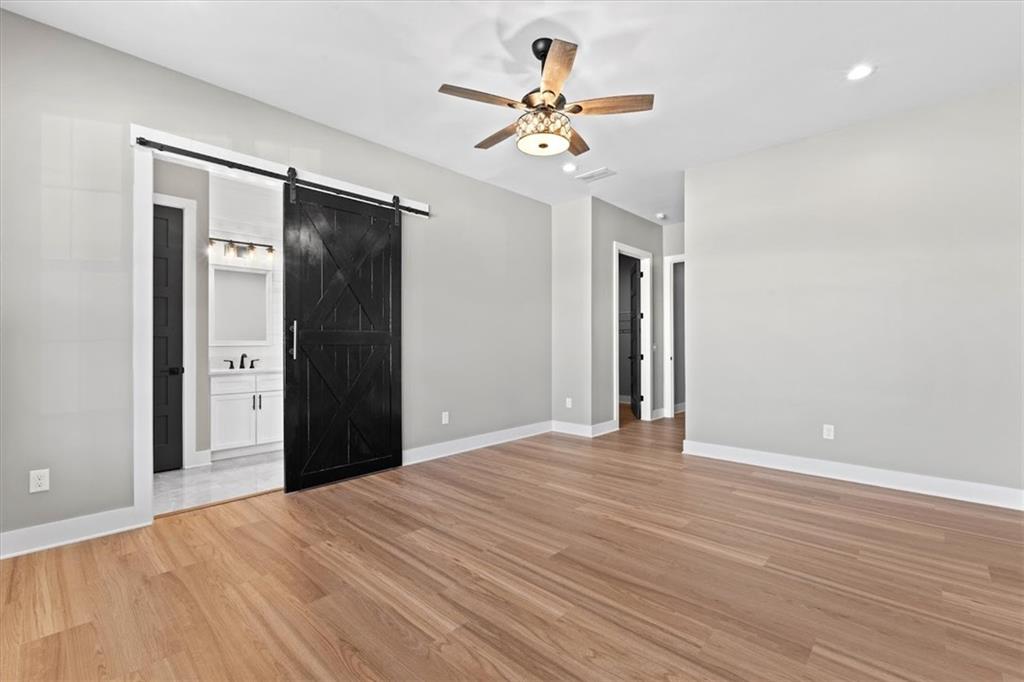 1237 Morgan Road Temple, GA 30179 - Photo 23 of 52 a view of an empty room with wooden floor