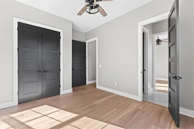 a bathroom with double vanity sink and two mirror