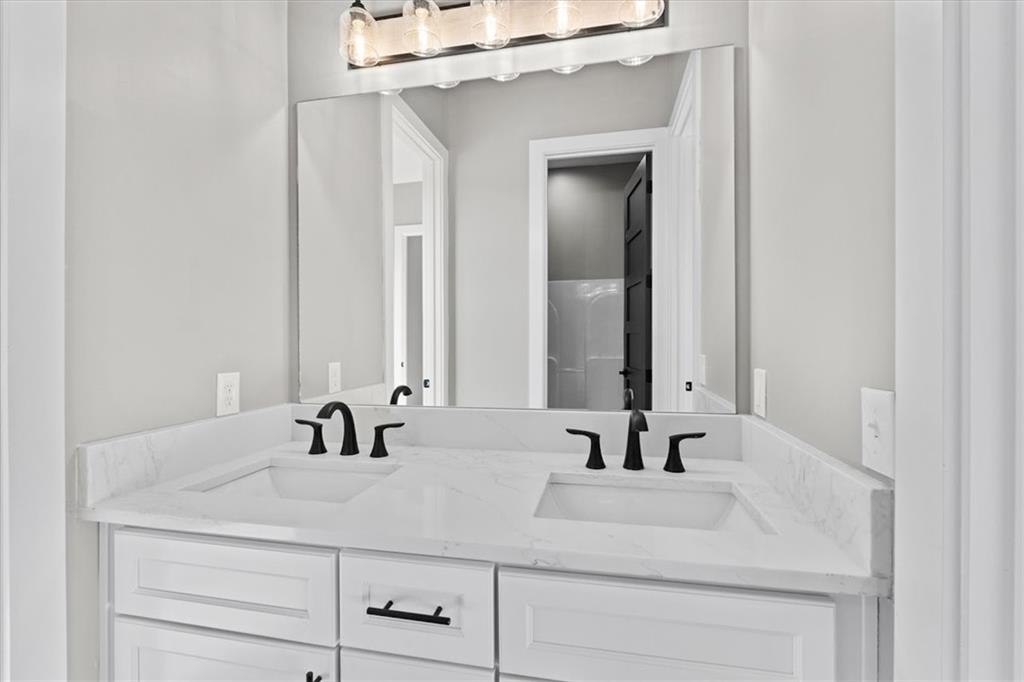 1237 Morgan Road Temple, GA 30179 - Photo 29 of 52 a bathroom with double vanity sink and two mirror