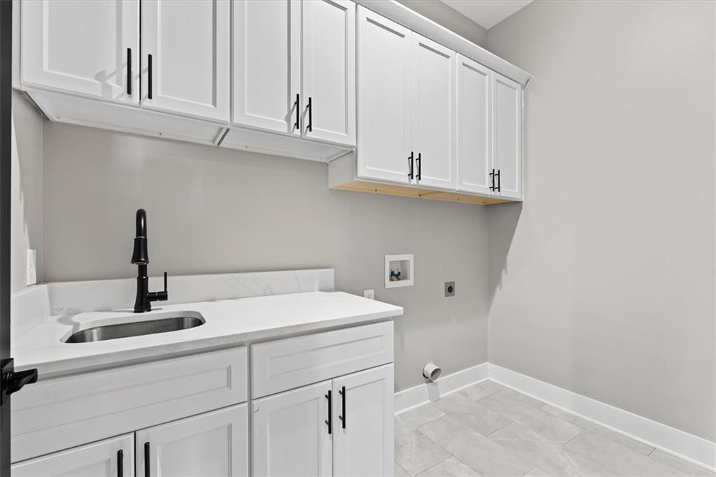1237 Morgan Road Temple, GA 30179 - Photo 33 of 52 a bathroom with a sink and cabinets