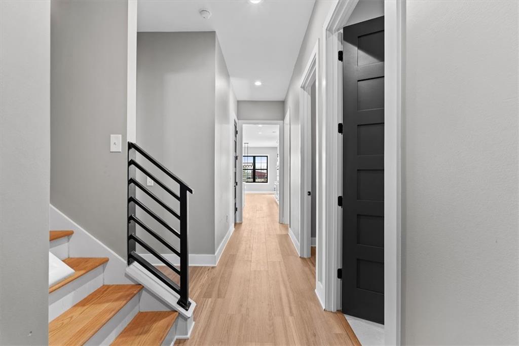 1237 Morgan Road Temple, GA 30179 - Photo 35 of 52 a view of a hallway with wooden floor and staircase
