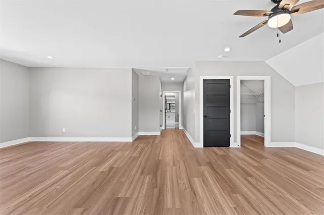 a bathroom with a toilet a sink and a mirror