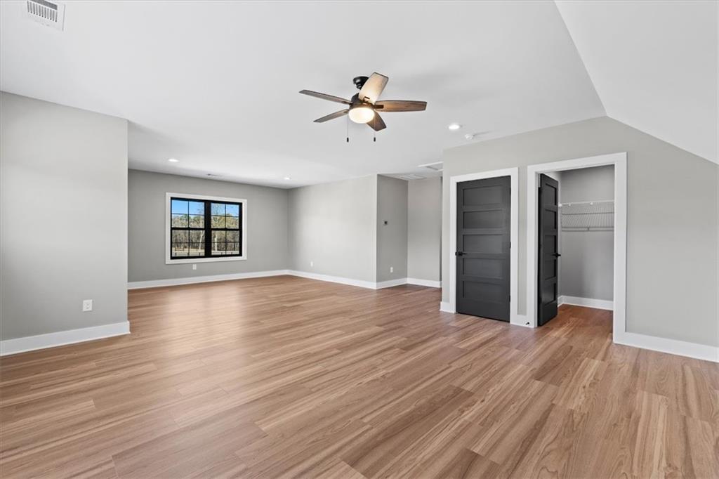 1237 Morgan Road Temple, GA 30179 - Photo 39 of 52 wooden floor in an empty room with a window
