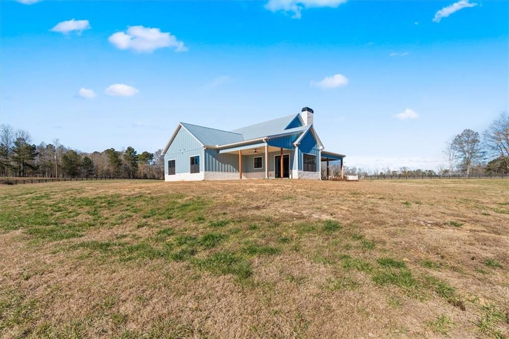 1237 Morgan Road Temple, GA 30179 - Photo 44 of 52 a view of a house with a yard