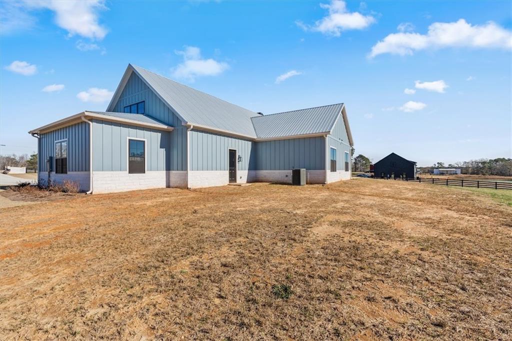 1237 Morgan Road Temple, GA 30179 - Photo 46 of 52 a view of a house with a yard