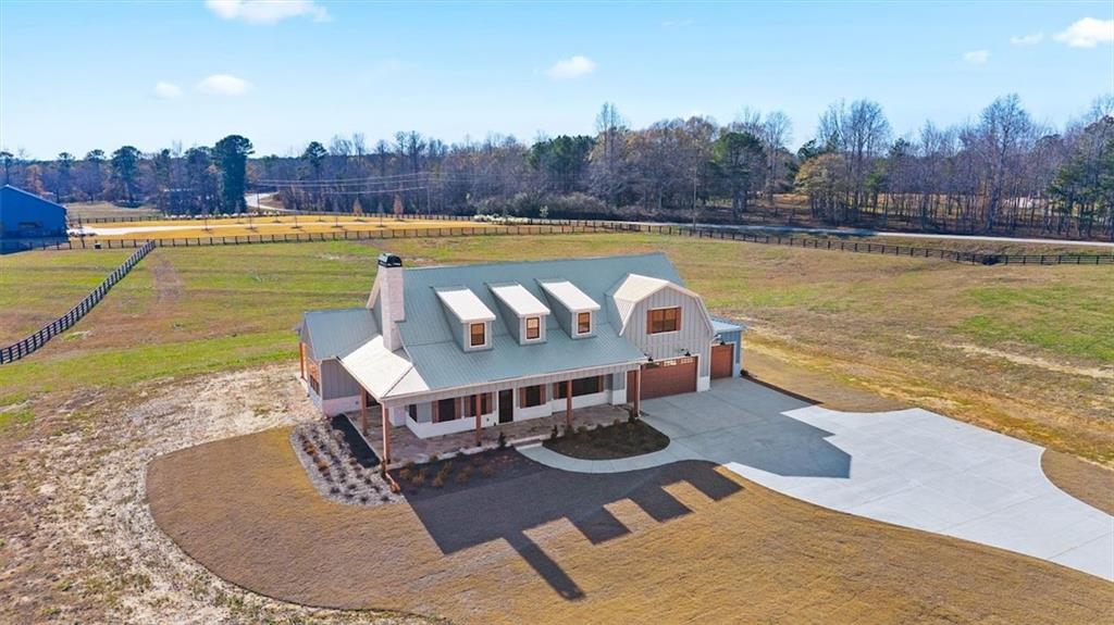1237 Morgan Road Temple, GA 30179 - Photo 7 of 52 swimming pool with outdoor seating and a garden