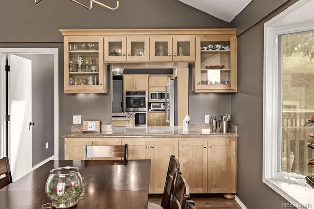 a view of a kitchen with granite countertop a window