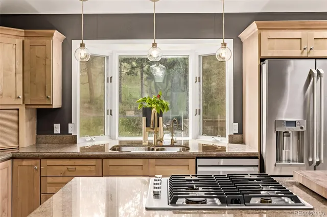 a view of a kitchen cabinets and wooden floor