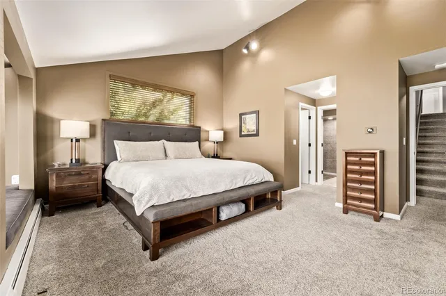 a spacious bathroom with a tub sink and mirror