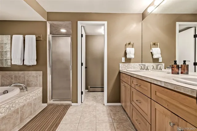 a bathroom with a granite countertop sink a toilet and a mirror