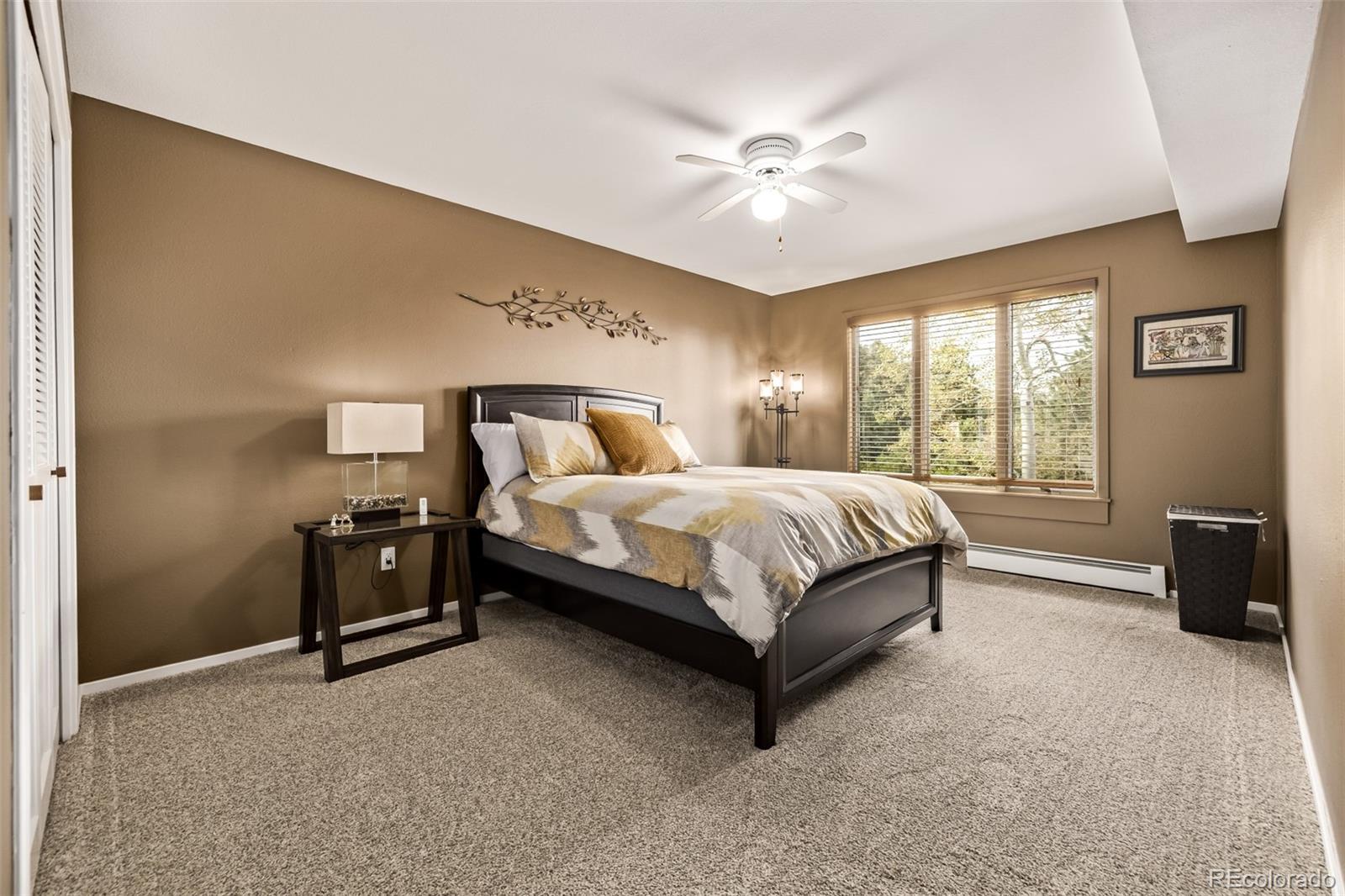 1139 Genesee Vista Road Golden, CO 80401 - Photo 31 of 43 a bedroom with a bed and window