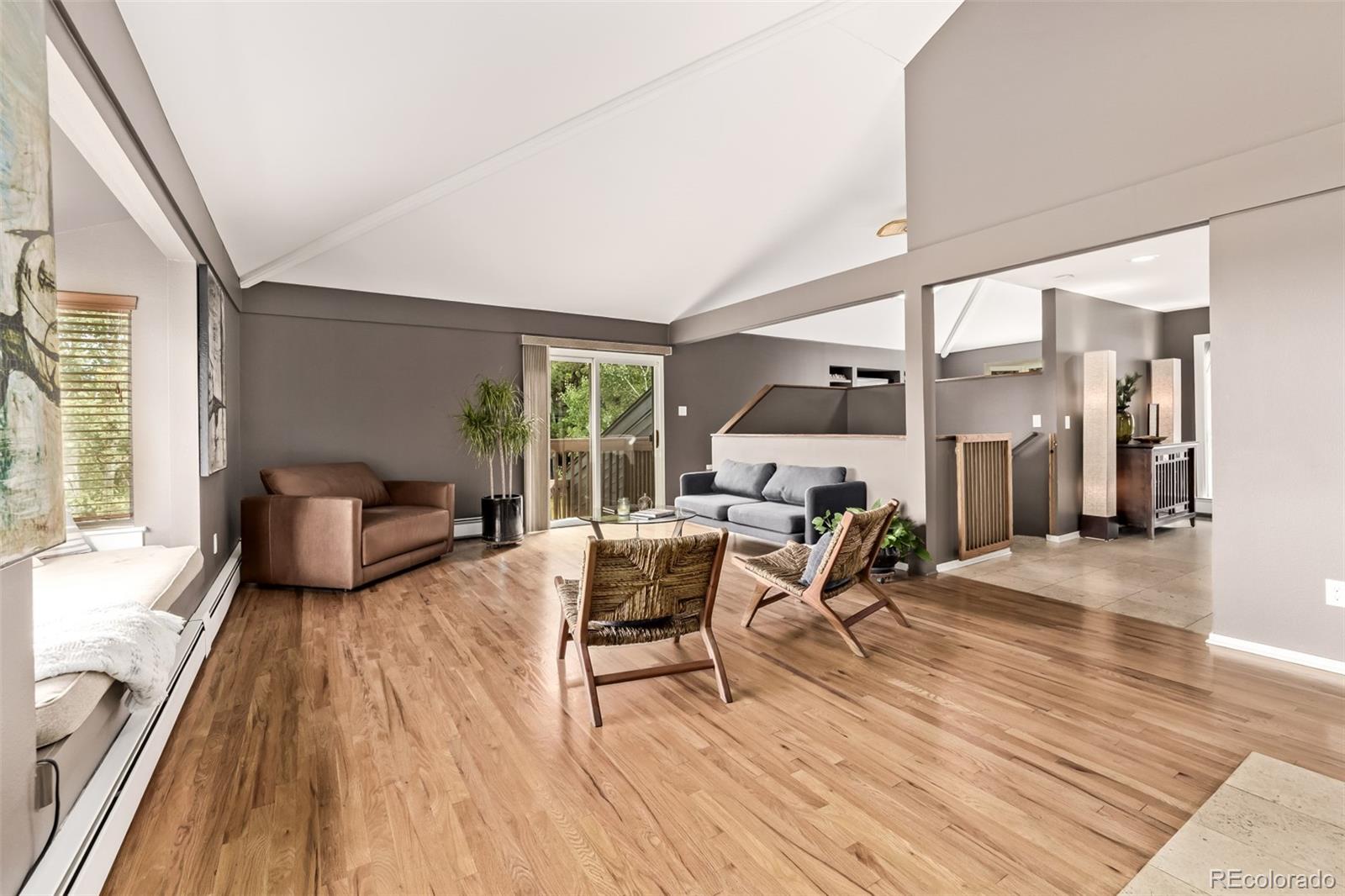 1139 Genesee Vista Road Golden, CO 80401 - Photo 6 of 43 a living room with furniture and a wooden floor