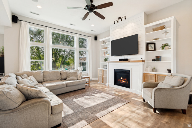 332 South 500 West Payson, UT 84651 - Photo 7 of 50 Living room featuring wood style lvp flooring and a ceiling fan