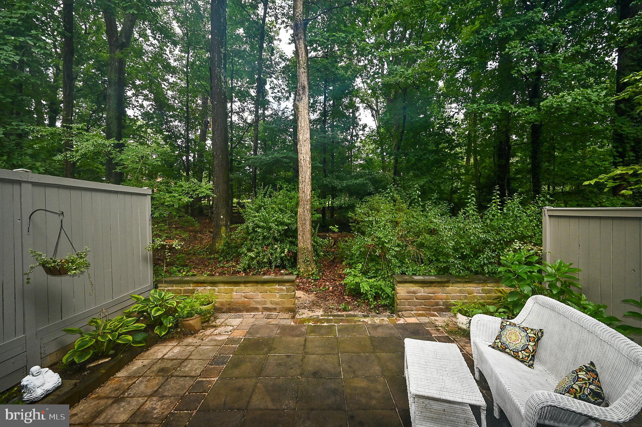 12013 Insha Court Reston, VA 20191 - Photo 34 of 35 Rear patio backs to treed common space