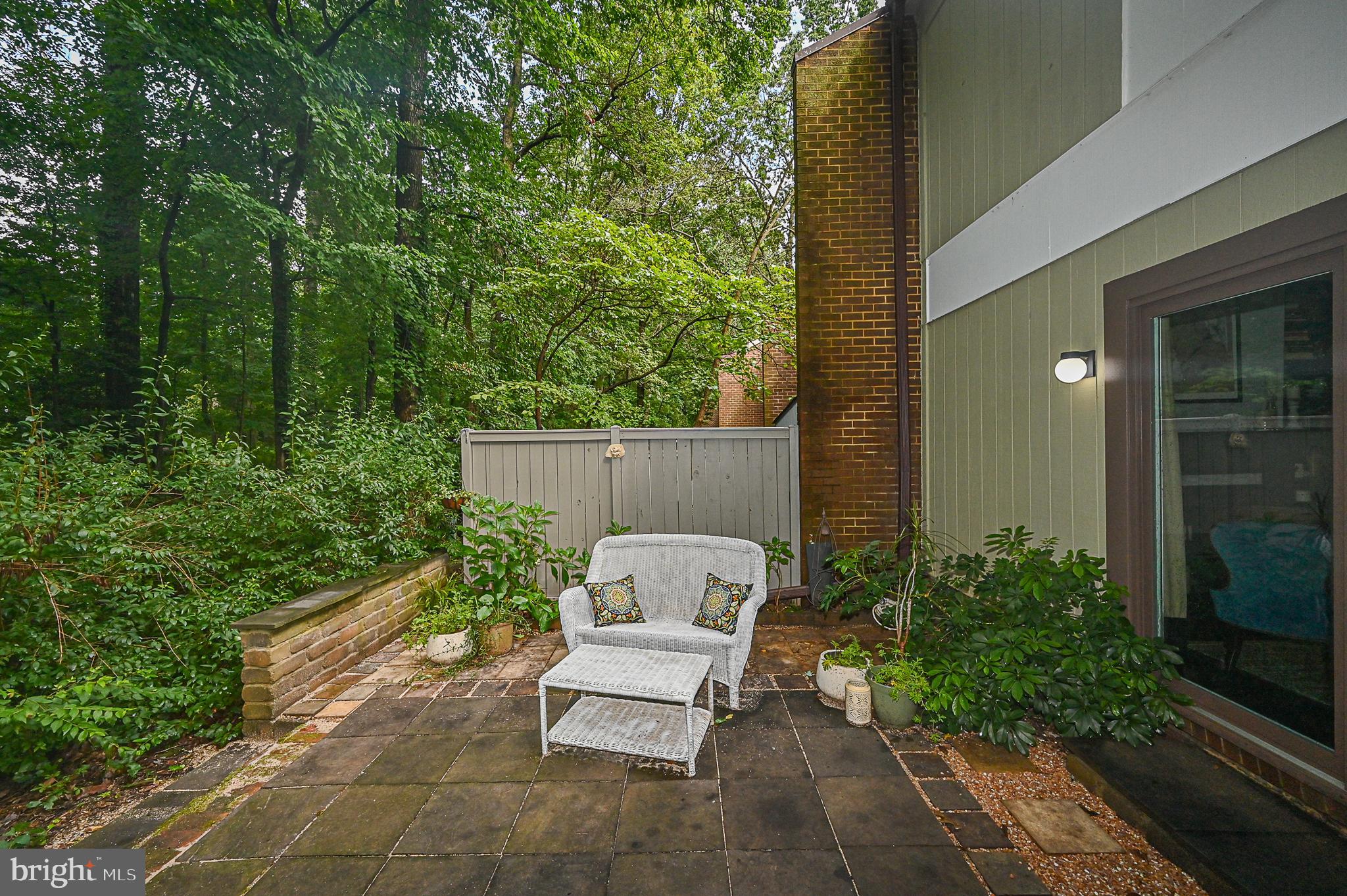 12013 Insha Court Reston, VA 20191 - Photo 35 of 35 Flagstone patio with brick knee wall