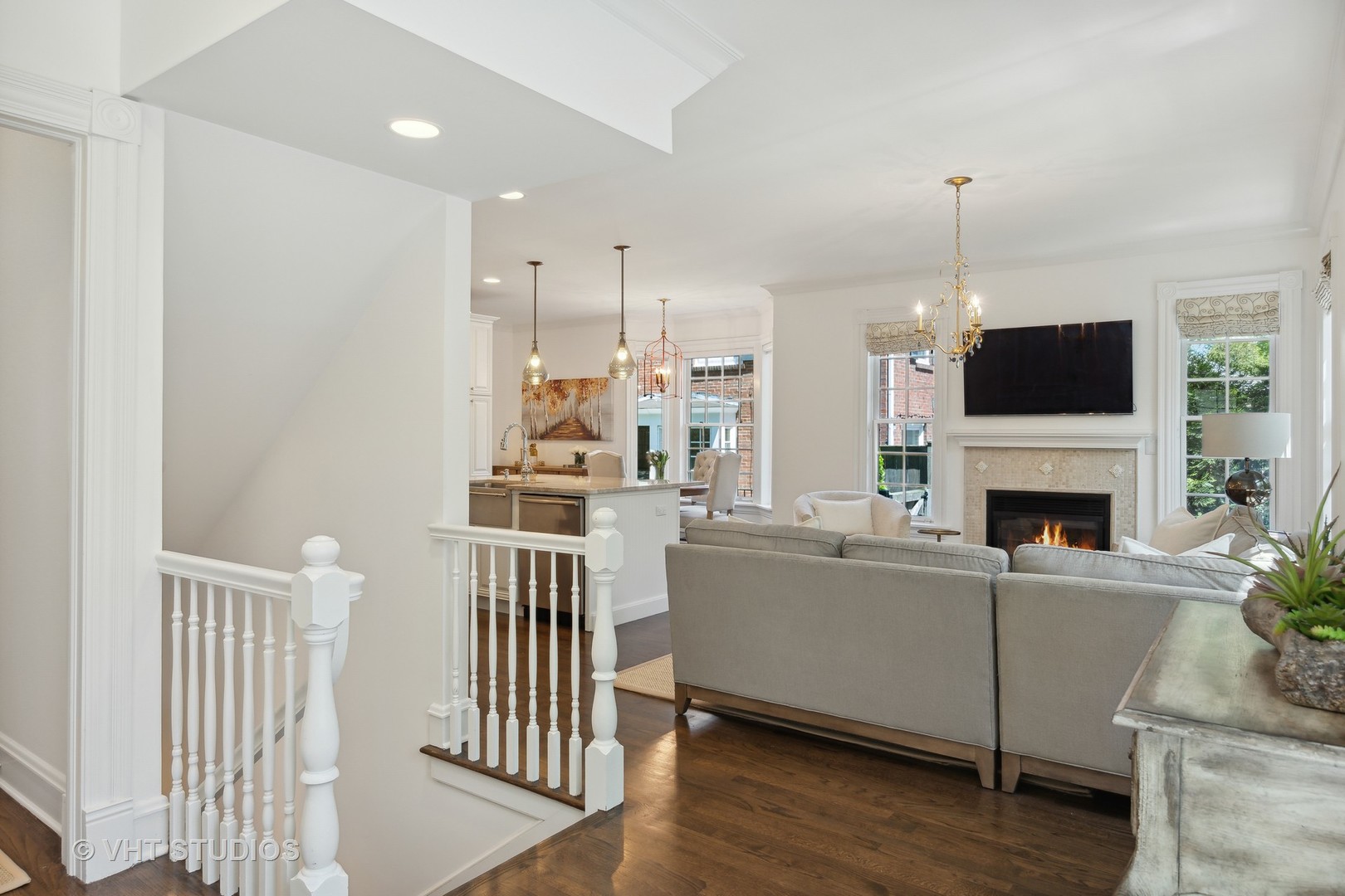 576 Sunset Road Winnetka, IL 60093 - Photo 14 of 42 a living room with furniture a fireplace and a flat screen tv