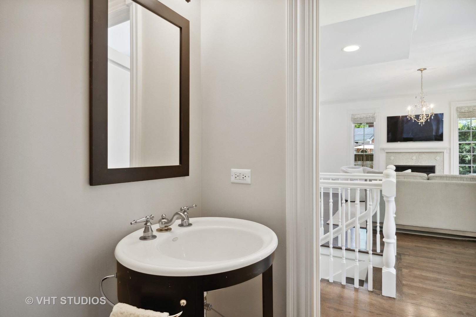 576 Sunset Road Winnetka, IL 60093 - Photo 16 of 42 a bathroom with a sink a mirror and a toilet