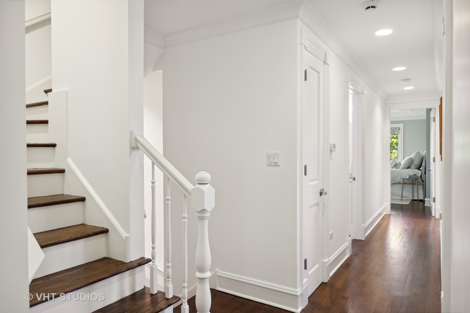 576 Sunset Road Winnetka, IL 60093 - Photo 26 of 42 a view of a hallway with wooden floor and entryway