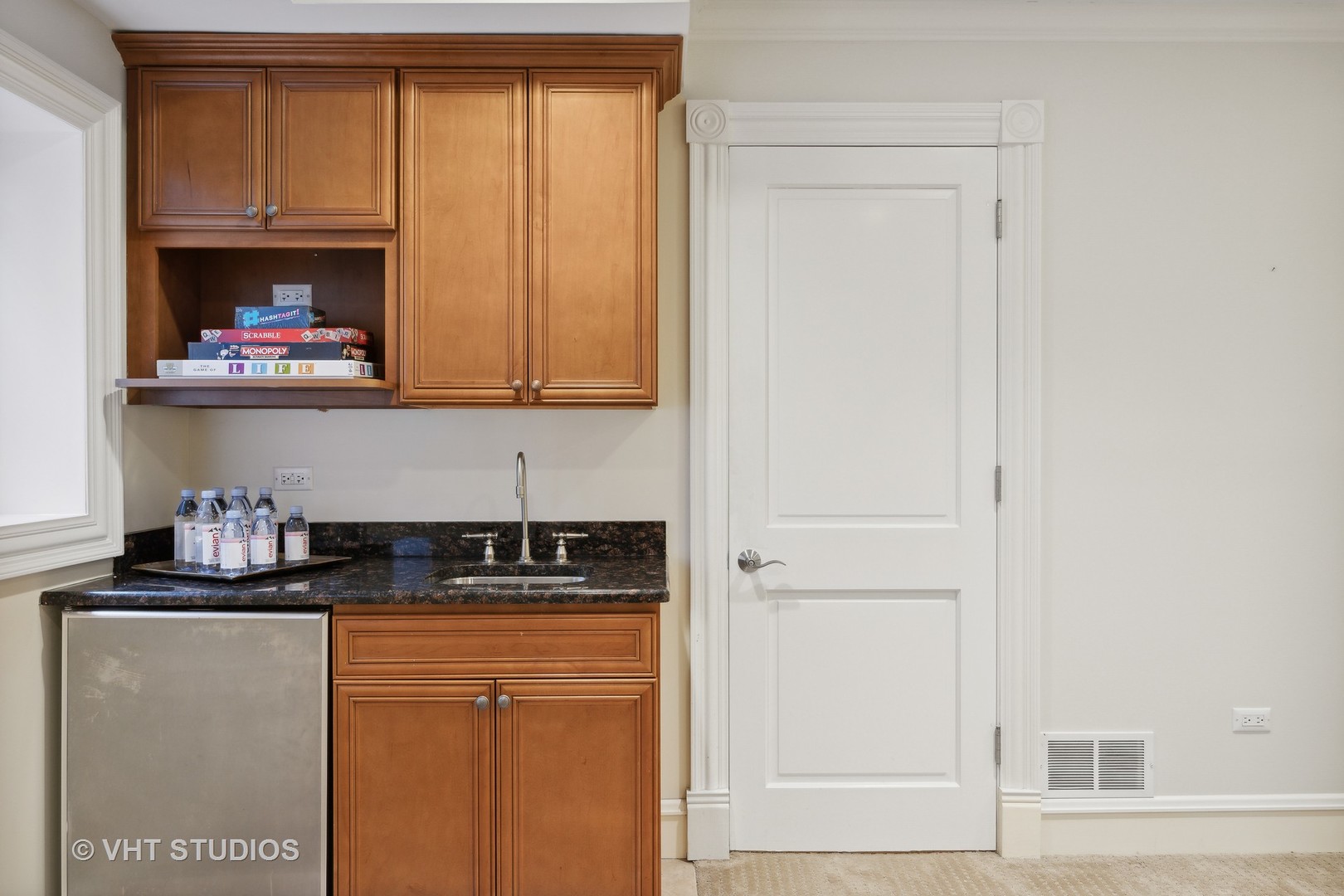 576 Sunset Road Winnetka, IL 60093 - Photo 30 of 42 a kitchen with a refrigerator and cabinets