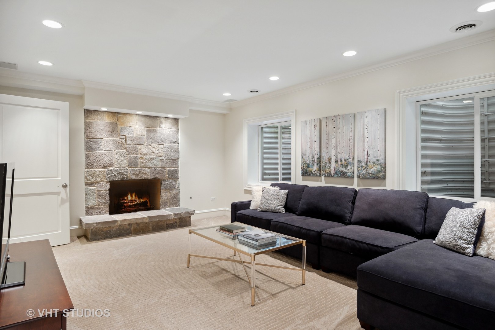 576 Sunset Road Winnetka, IL 60093 - Photo 32 of 42 a living room with furniture and a fireplace