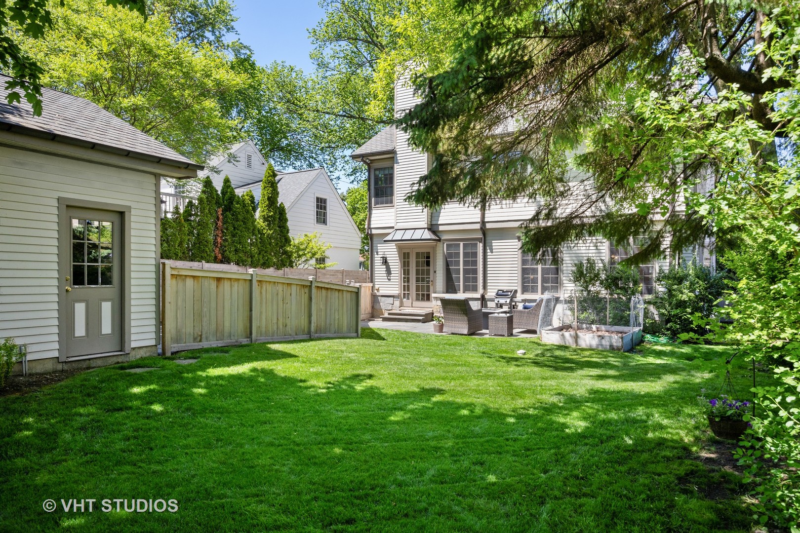 576 Sunset Road Winnetka, IL 60093 - Photo 37 of 42 a view of a house with a yard and sitting area
