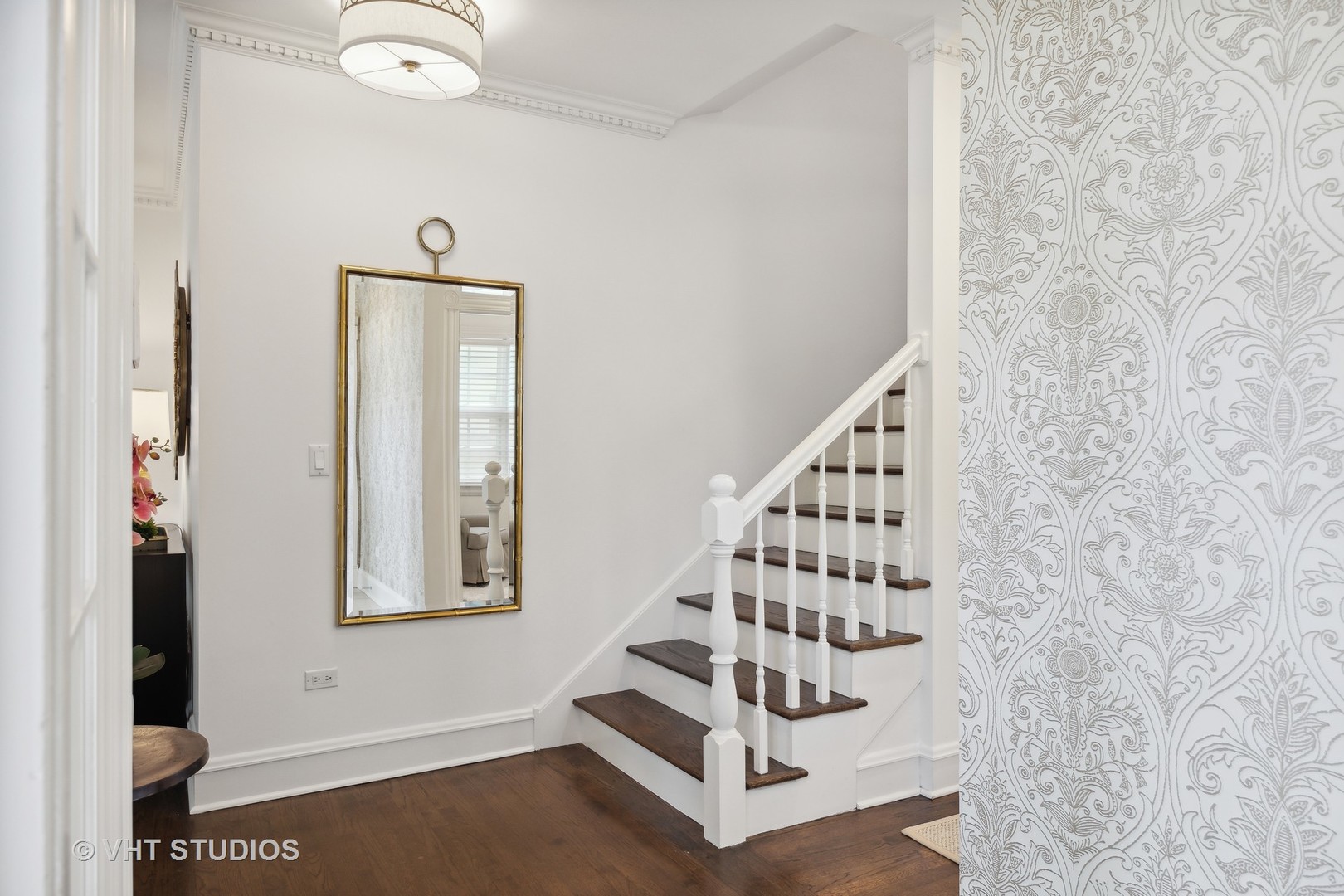 576 Sunset Road Winnetka, IL 60093 - Photo 5 of 42 a view of staircase with white walls and windows