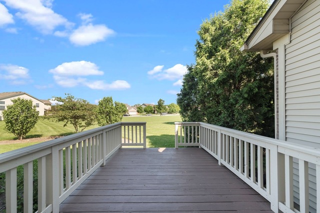 964 Oak Ridge Boulevard Elgin, IL 60120 - Photo 22 of 25 a view of a balcony with wooden floor