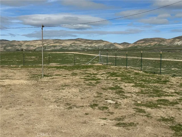 a view of a lake view with mountain in the background