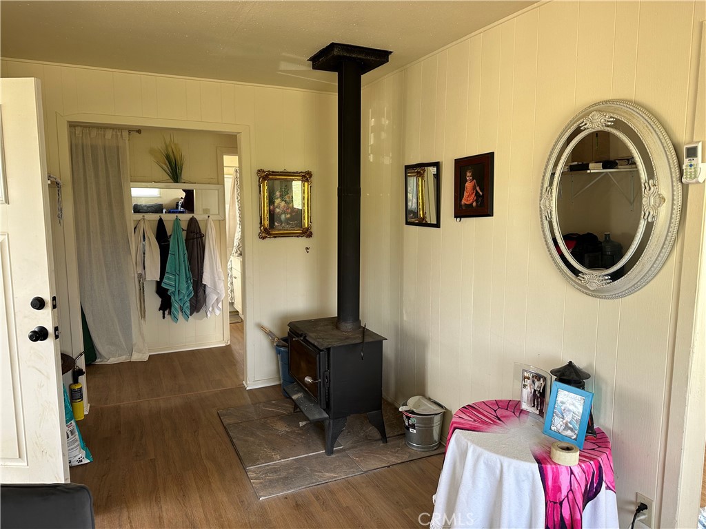 14355 Bella Road Santa Margarita, CA 93453 - Photo 4 of 6 a bedroom with a bed and wooden floor