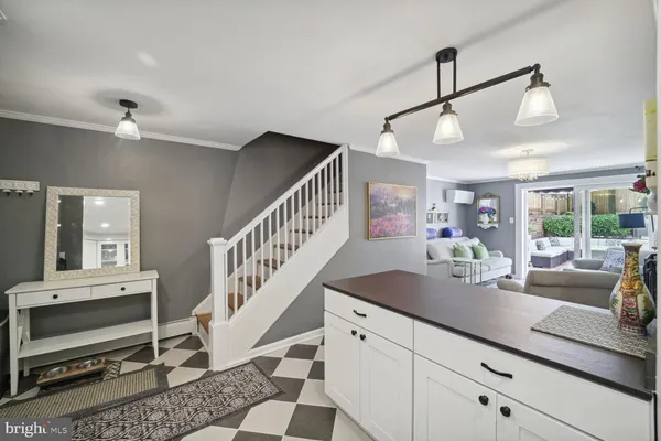 a view of hall way with furniture and staircase