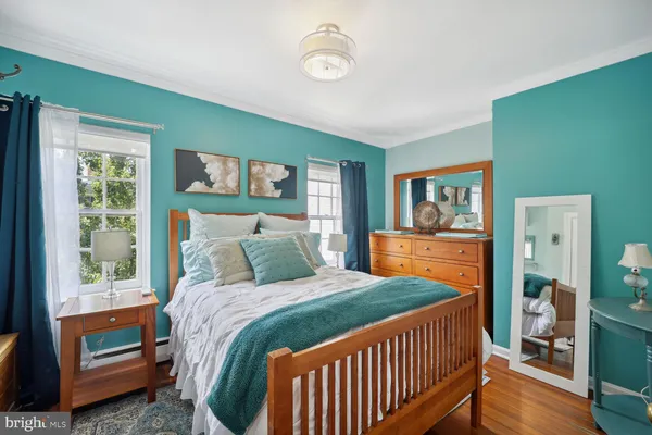 a bedroom with a bed and a view of bedroom