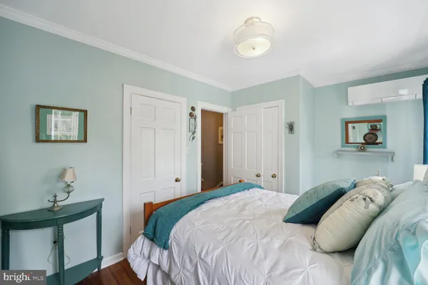 a bedroom with a bed and a table in it