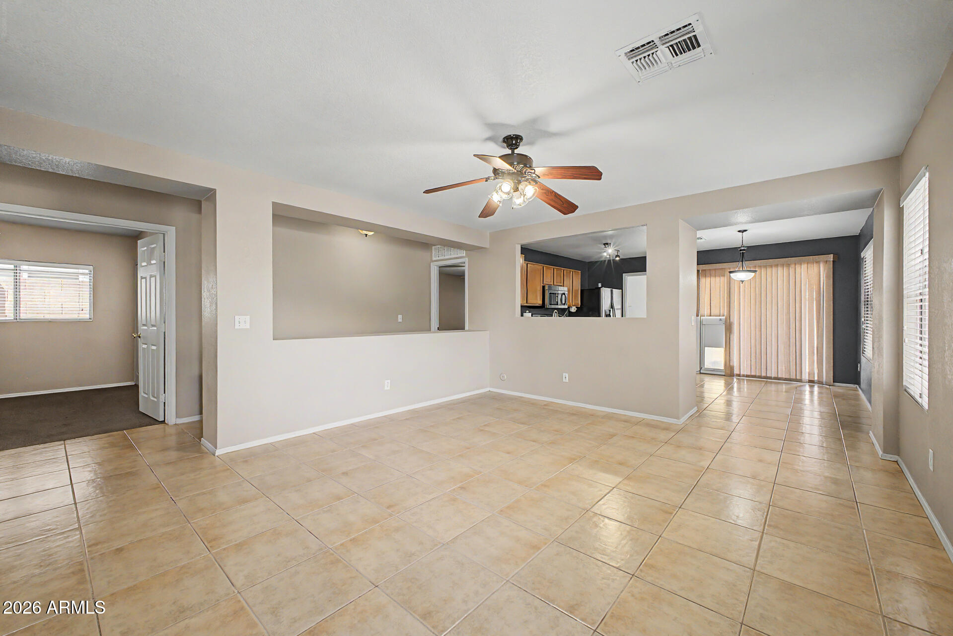 3489 South Bowman Road Apache Junction, AZ 85119 - Photo 3 of 24 a view of an empty room with a window