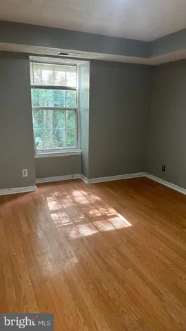 a kitchen with kitchen island granite countertop a sink and a stove