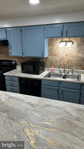 a view of a room that has a floor to ceiling window and an outdoor view