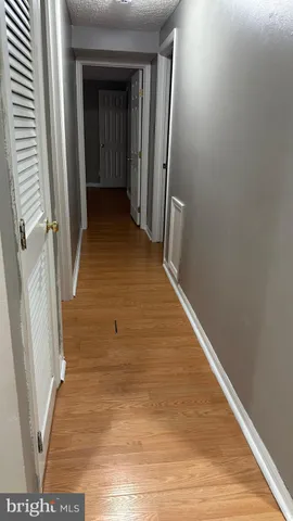 a kitchen with stainless steel appliances wooden cabinets and a sink