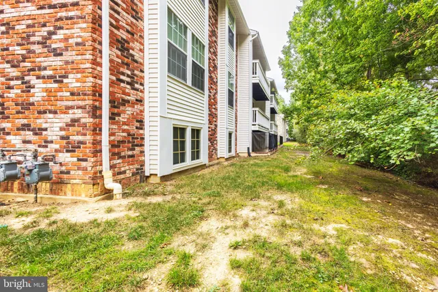 a view of an house with backyard of the house