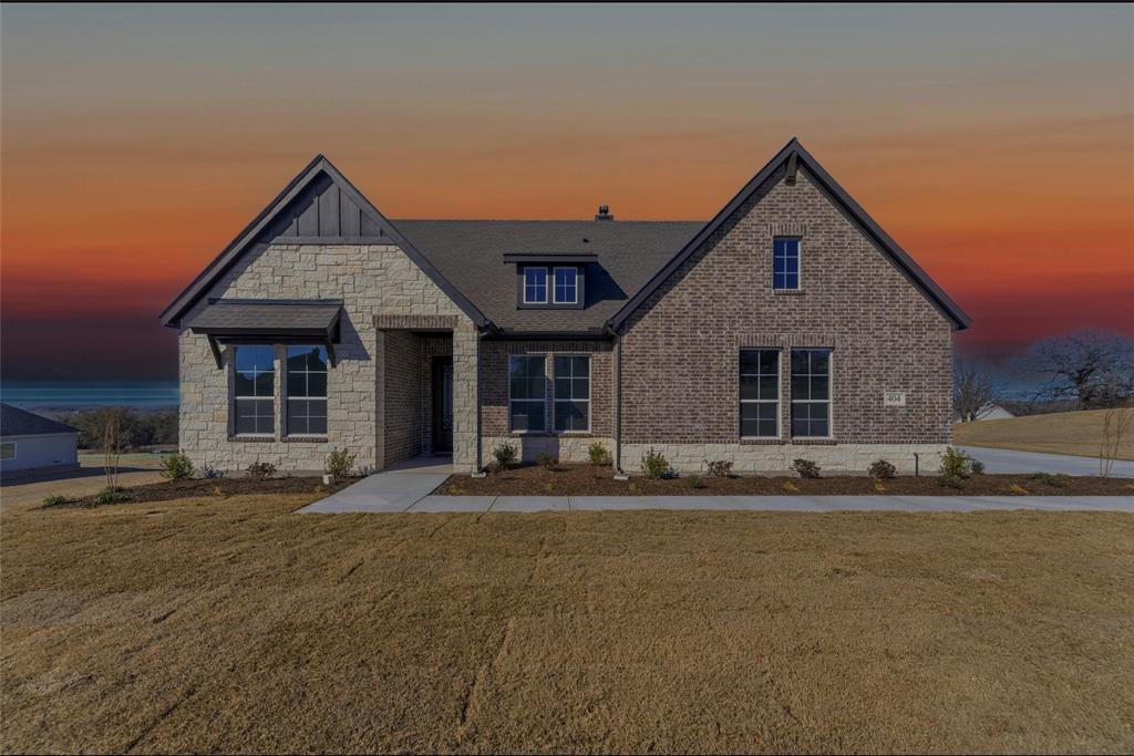 a front view of a house with a outdoor space