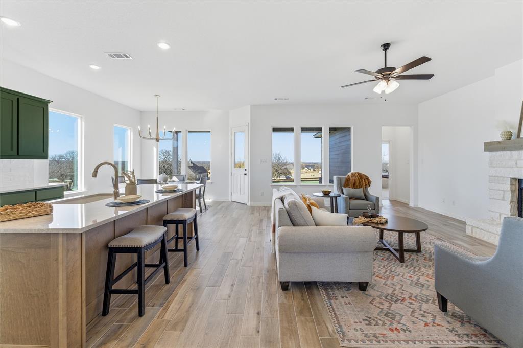 404 Hayden Faith Court Springtown, TX 76082 - Photo 11 of 24 a living room with furniture and a wooden floor
