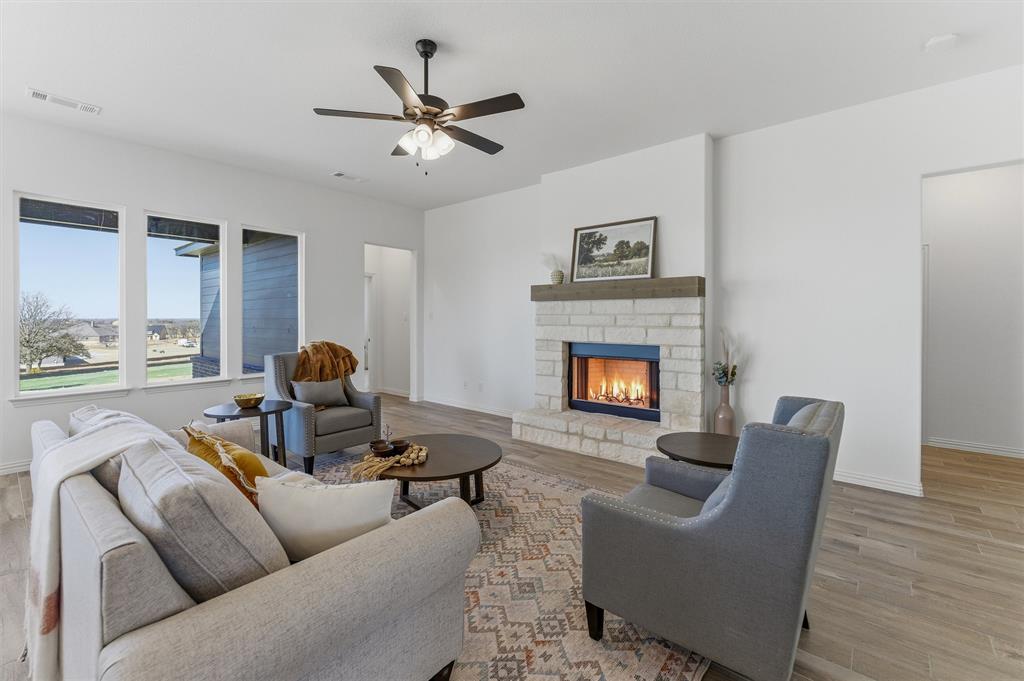 404 Hayden Faith Court Springtown, TX 76082 - Photo 13 of 24 a living room with furniture and a fireplace