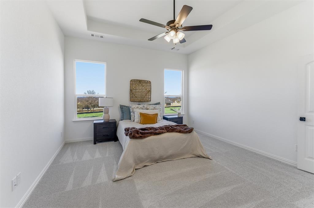 404 Hayden Faith Court Springtown, TX 76082 - Photo 17 of 24 a living room with furniture and a chandelier