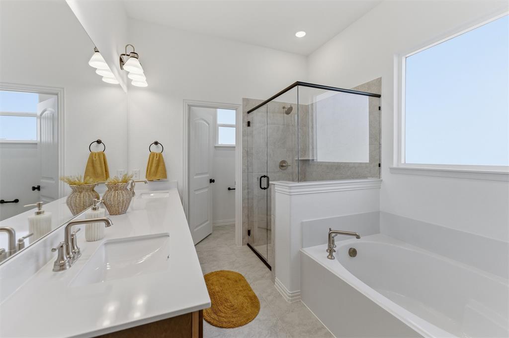 404 Hayden Faith Court Springtown, TX 76082 - Photo 19 of 24 a bathroom with a tub a sink and mirror