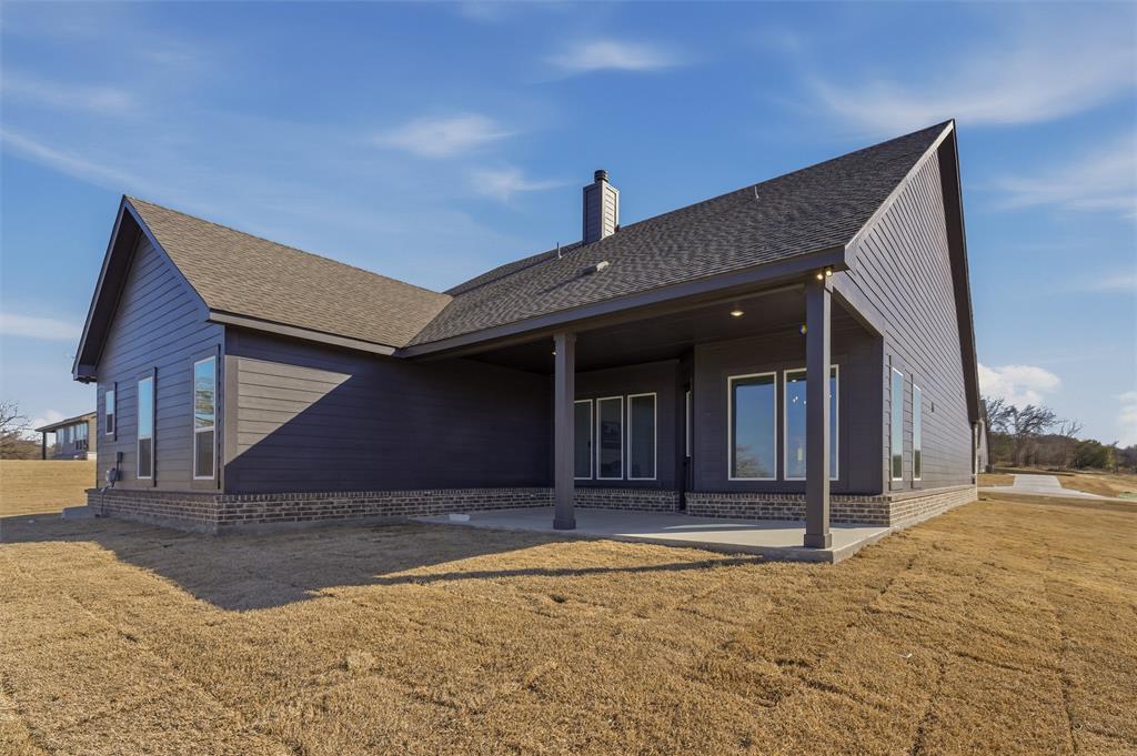 404 Hayden Faith Court Springtown, TX 76082 - Photo 23 of 24 a view of house with backyard