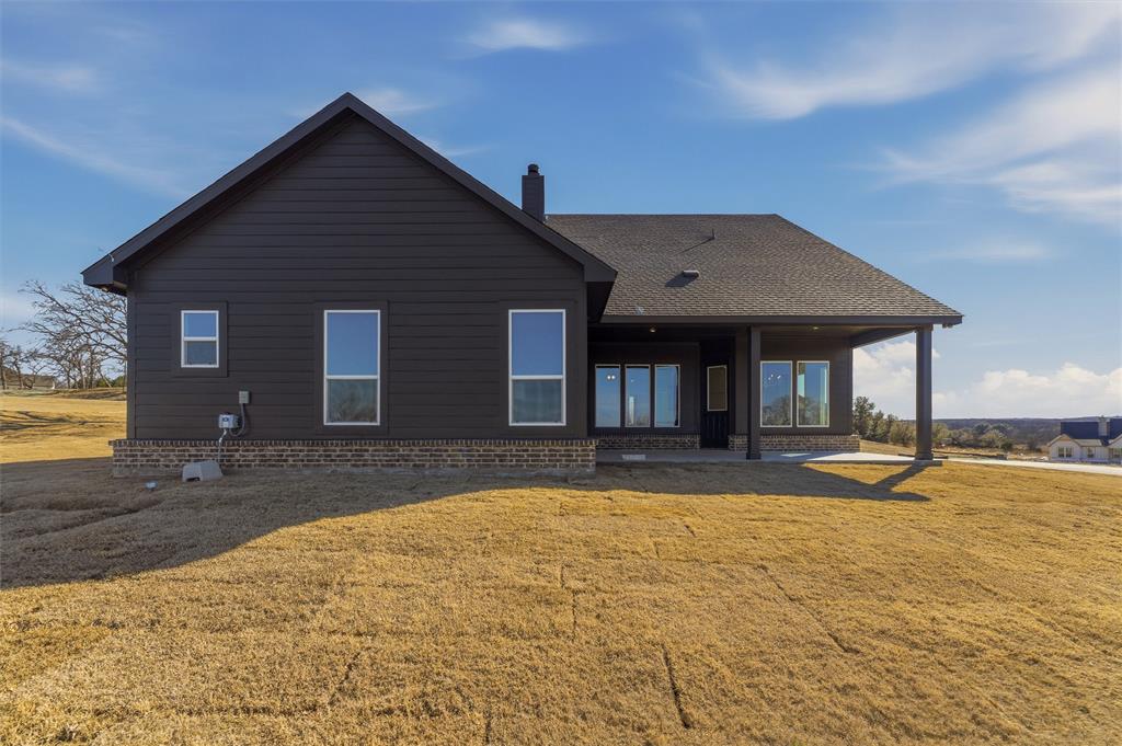 404 Hayden Faith Court Springtown, TX 76082 - Photo 24 of 24 a view of a house with swimming pool and sitting area