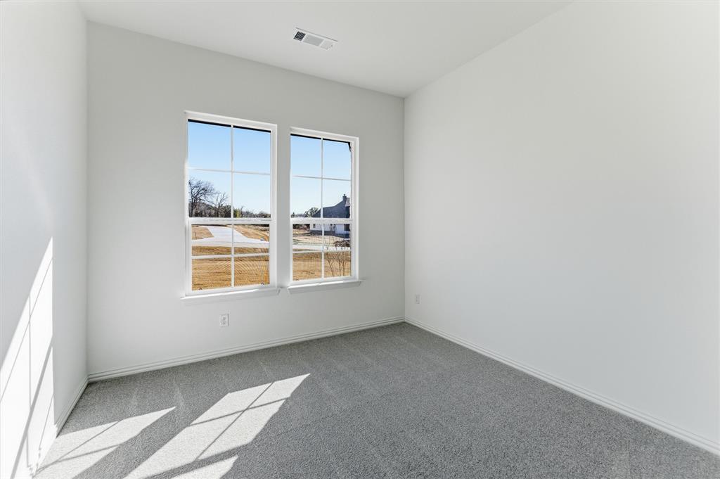 404 Hayden Faith Court Springtown, TX 76082 - Photo 7 of 24 an empty room with a window